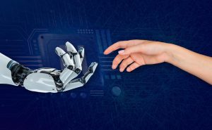 A human hand reaching out toward a white and black robotic hand, almost touching fingers against a dark blue background overlaid with digital circuit board graphics and abstract network lines.